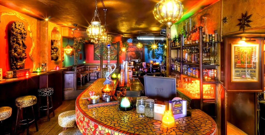 The mosaic bar under Moroccan lanterns